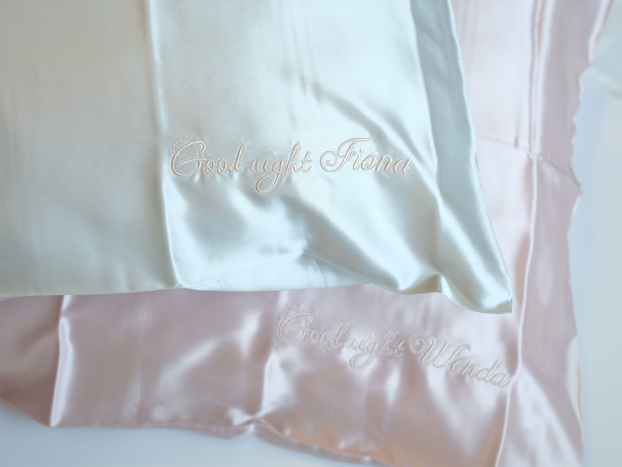 Close-up of personalized 22 momme double sided silk pillowcase with custom embroidered name detail
