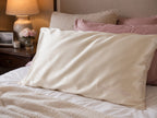 Gold silk pillowcase on pillow with personalized embroidered name