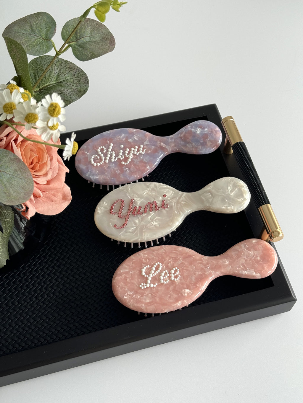 Personalized mini brushes in three colors (purple, pearl white, pink) with rhinestone names, a gift set for friends or bridesmaids.