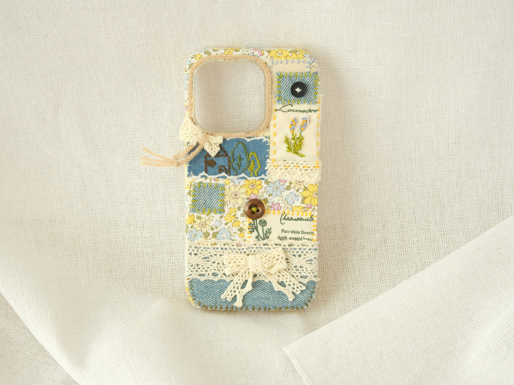 Handmade patchwork phone case with embroidery, lace, and floral patterns—"Pastel Garden" style for smartphones.