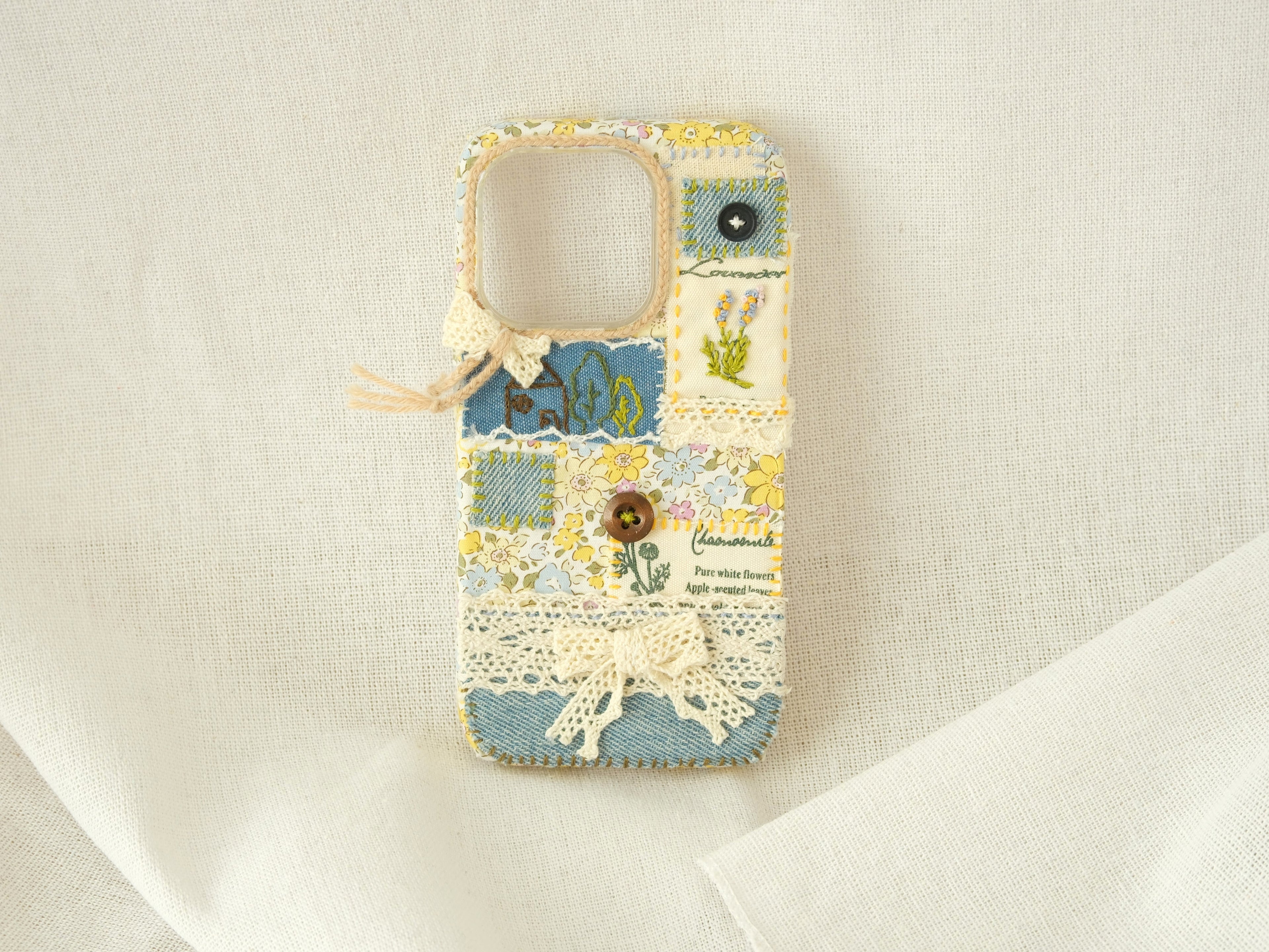 Handmade patchwork phone case with embroidery, lace, and floral patterns—"Pastel Garden" style for smartphones.