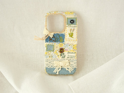 Handmade patchwork phone case with embroidery, lace, and floral patterns—"Pastel Garden" style for smartphones.