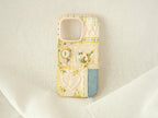 Handmade patchwork phone case with a floral heart, embroidered daisies, and lace, vintage romantic style.