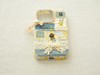Bottom view of the patchwork case with precise cutouts for the charging port and speakers.
