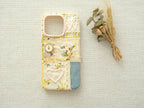 Handmade "Floral Heart" patchwork case on a neutral background, perfect as a romantic artisanal gift.