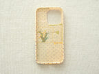 Interior view of the "Floral Heart" case showing a purple polka dot lining and handcrafted stitching details.