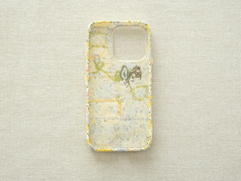 Interior view of the patchwork case showing the fabric lining and handcrafted seams.