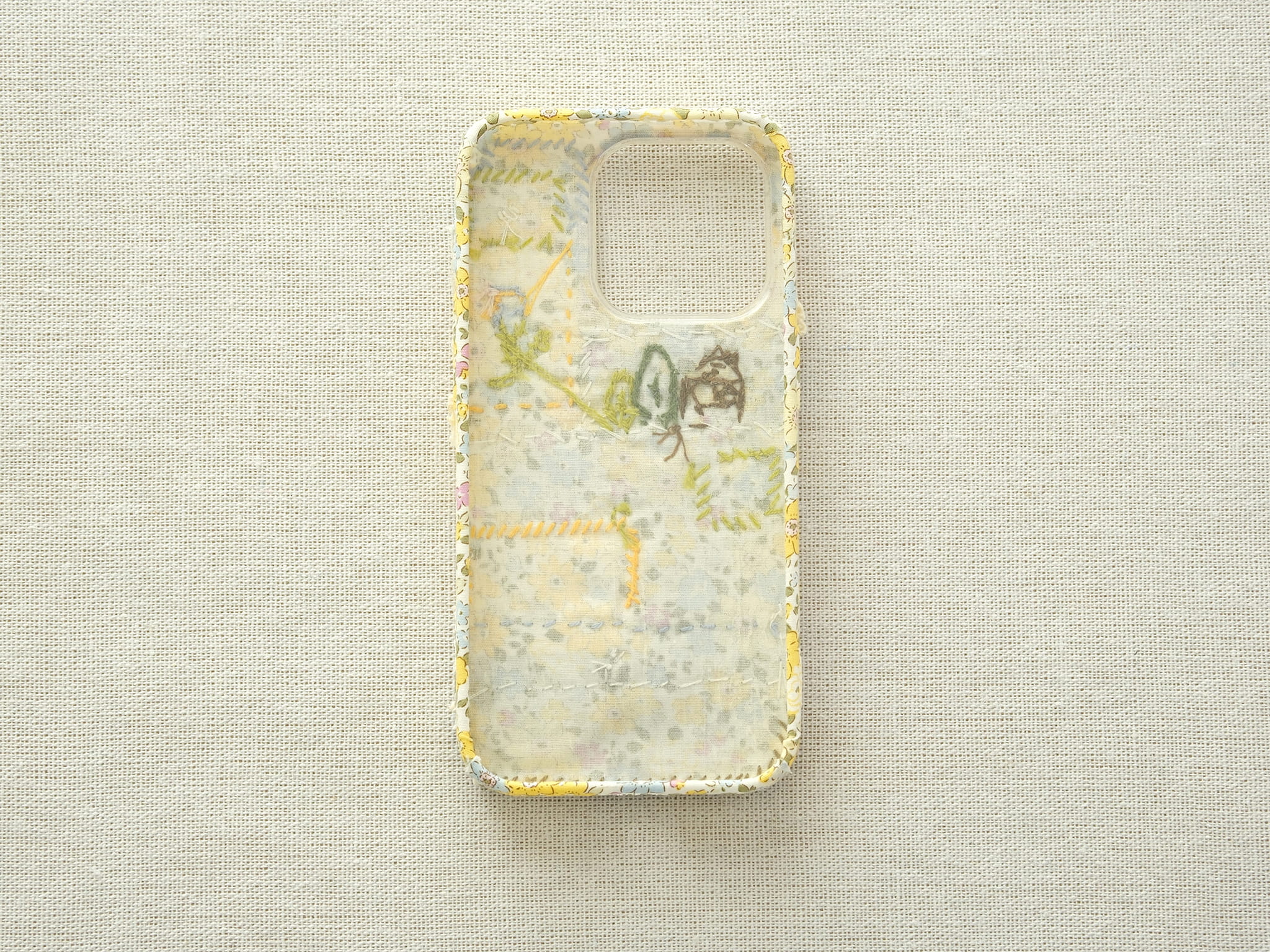 Interior view of the patchwork case showing the fabric lining and handcrafted seams.