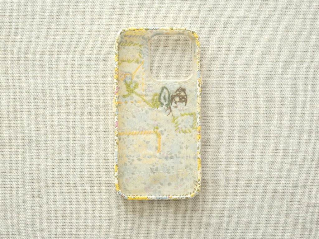 Interior view of the patchwork case showing the fabric lining and handcrafted seams.