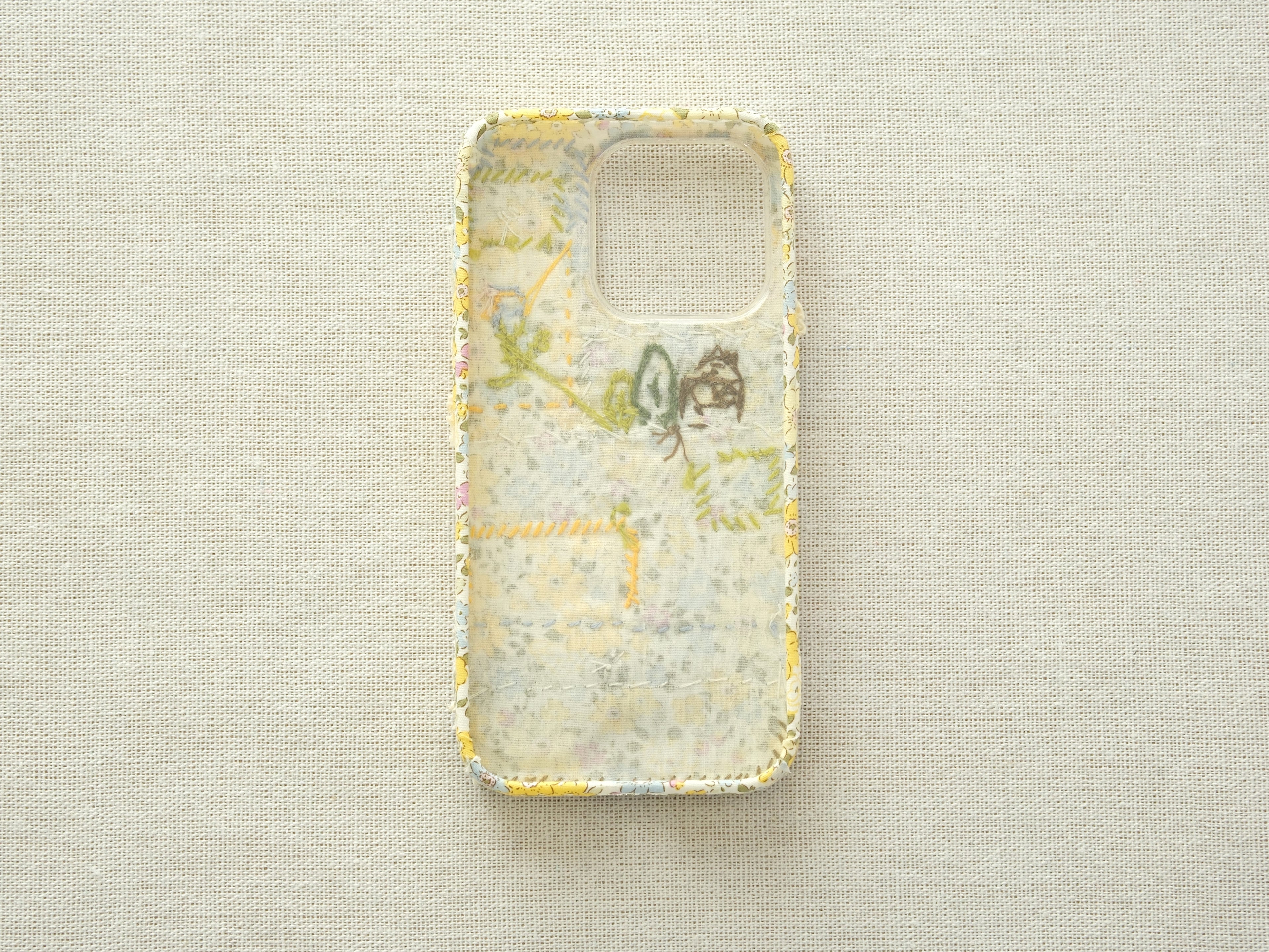 Interior view of the patchwork case showing the fabric lining and handcrafted seams.