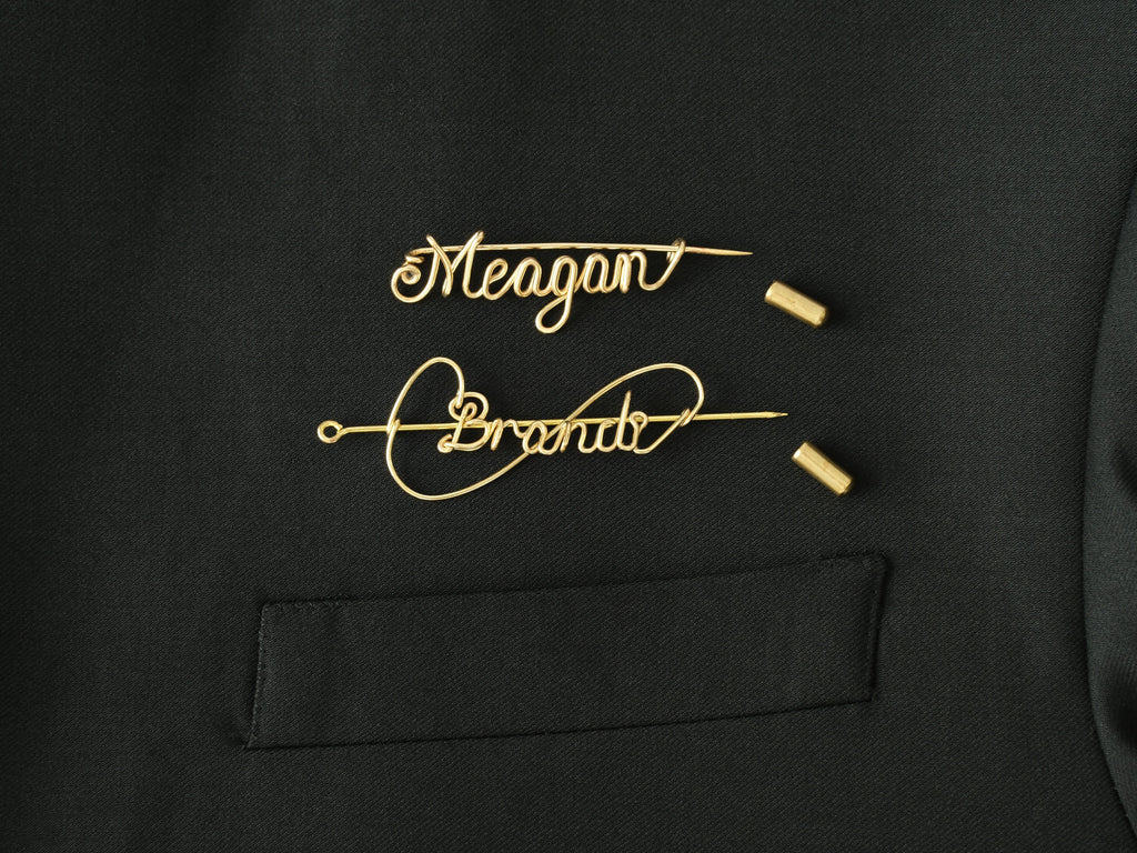 Detailed view of the protective cap closure on a custom gold name brooch.