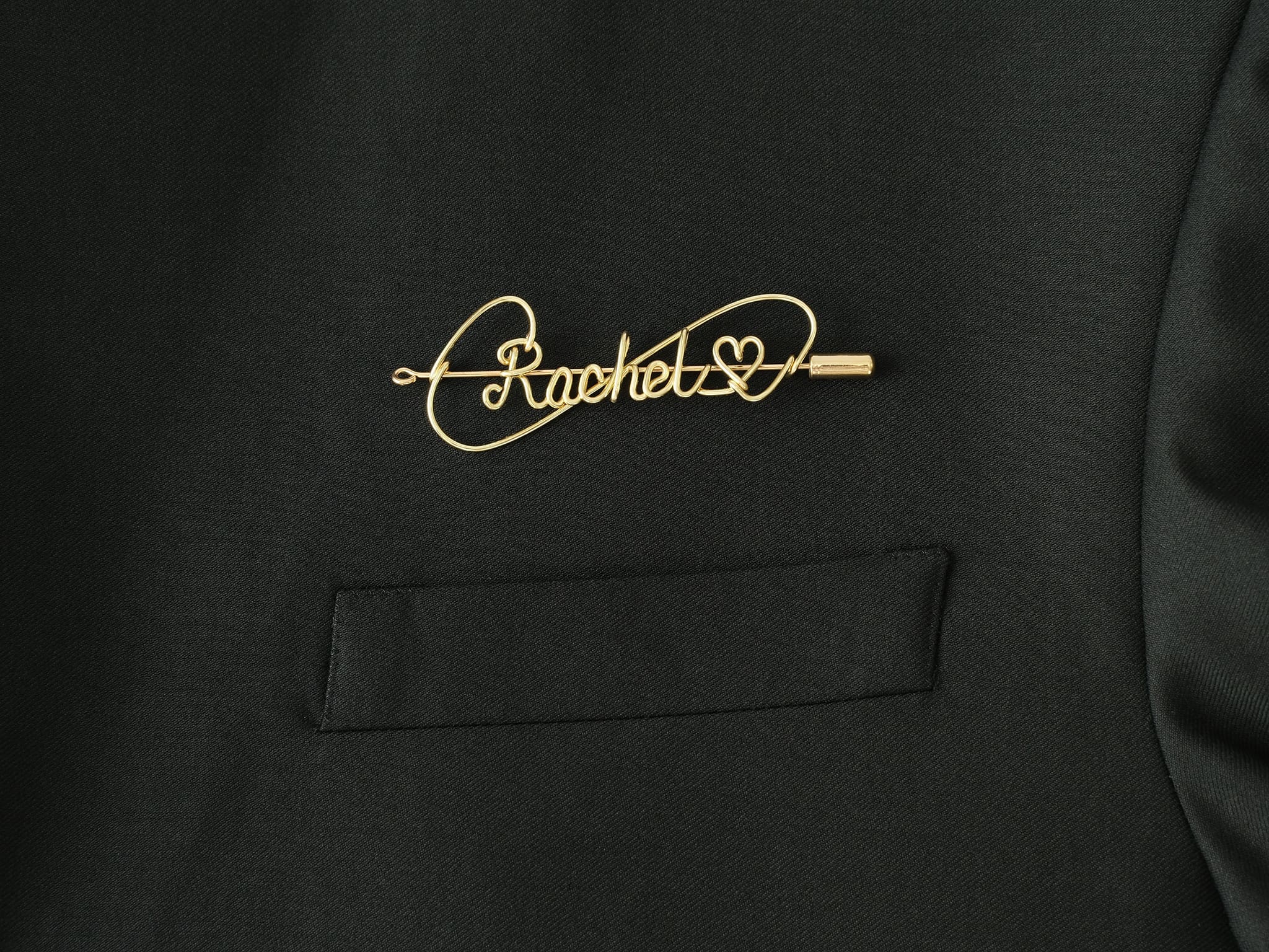 Custom name brooch with heart symbol, handmade in gold-plated copper for romantic gifts.