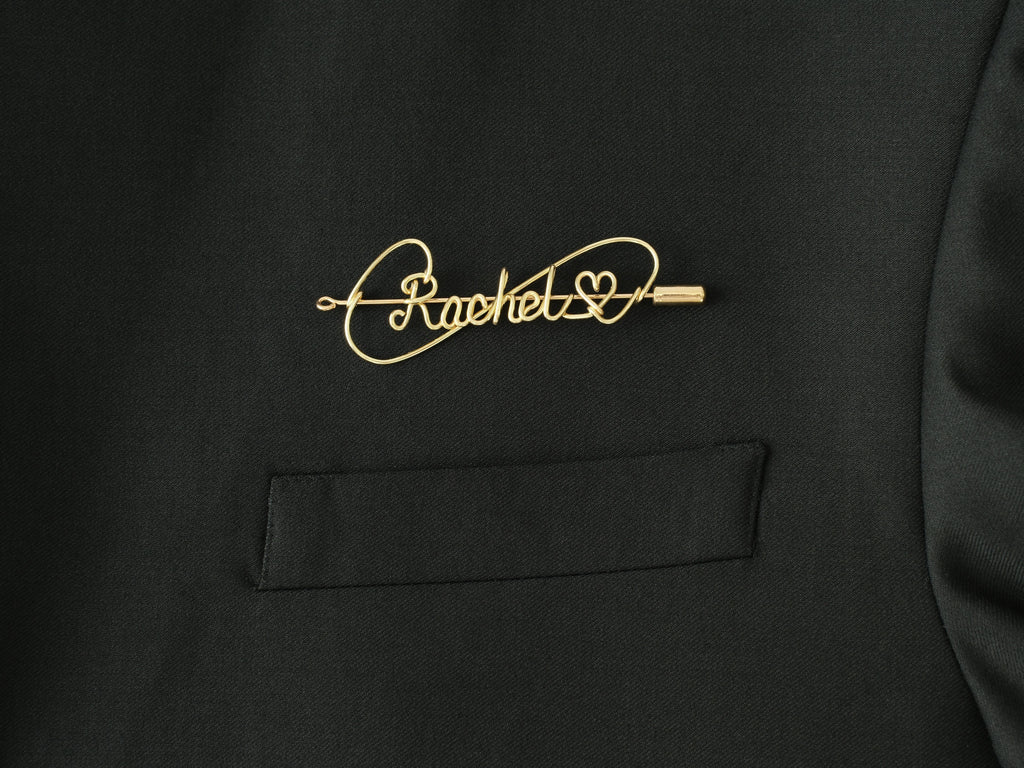 Custom name brooch with heart symbol, handmade in gold-plated copper for romantic gifts.