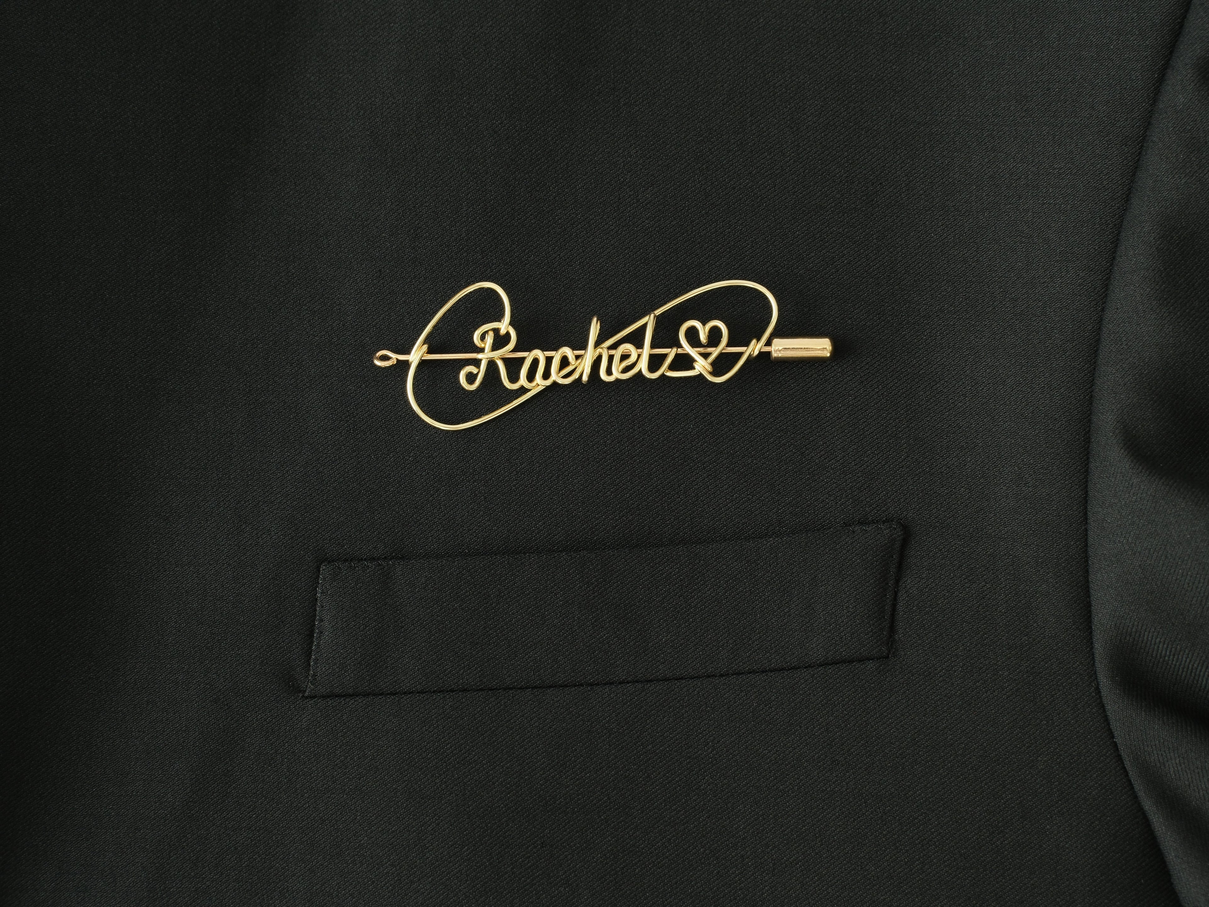 Custom name brooch with heart symbol, handmade in gold-plated copper for romantic gifts.