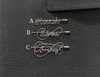 Comparison of three silver personalized name pin styles (A, B, C) on a dark green jacket, selection guide.
